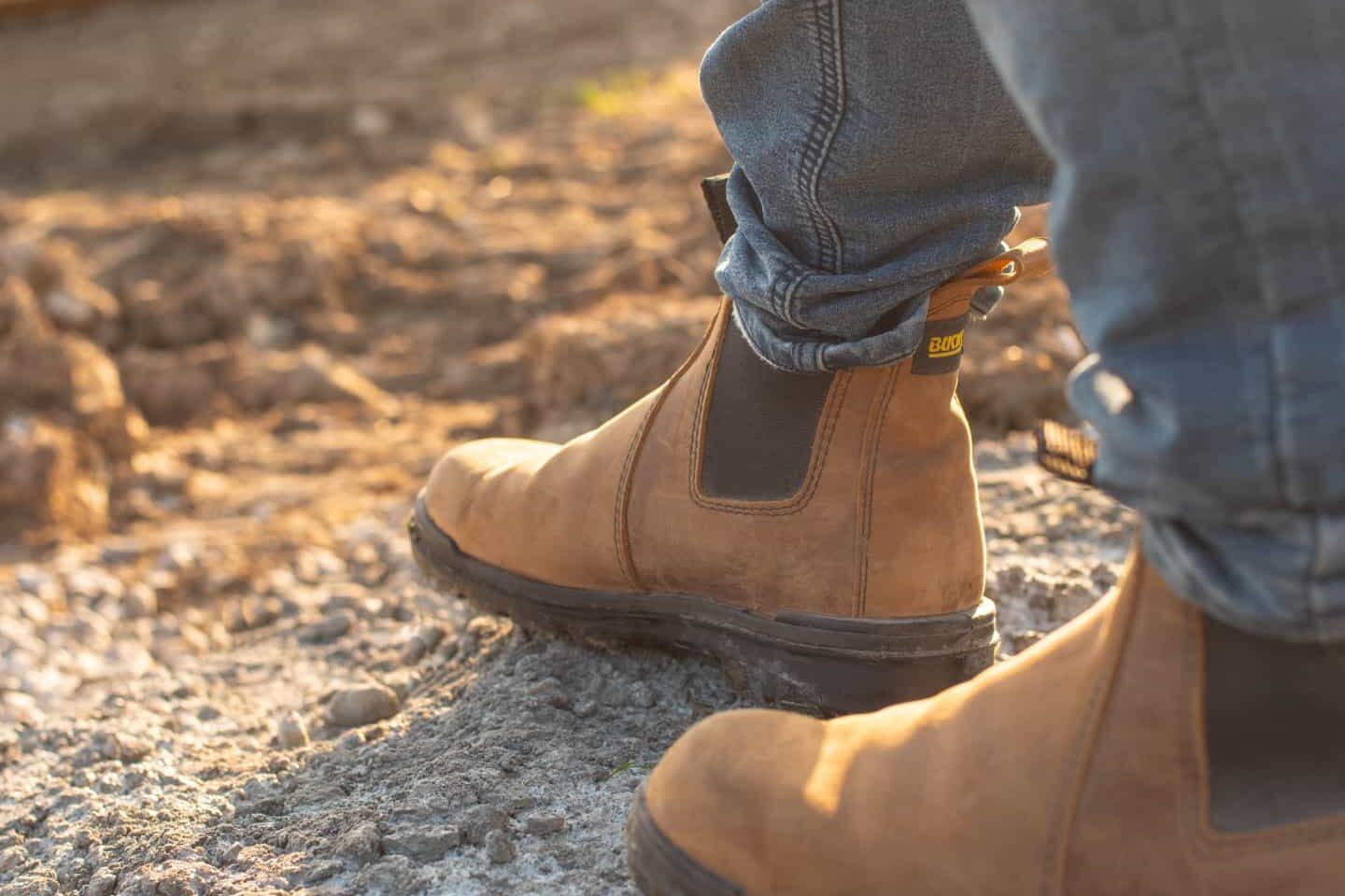 Tan Leather work boots on a construction site.